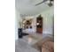 Open-concept living area with view into kitchen and barstool seating at 482 Pendleton Pl, Venice, FL 34292