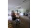 Spacious living room with ceiling fan, neutral paint, and dining area at 482 Pendleton Pl, Venice, FL 34292