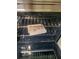 The clean oven is equipped with a built-in rack system, ready for baking and roasting delicious meals at 482 Pendleton Pl, Venice, FL 34292