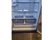 The stainless steel refrigerator boasts spacious, adjustable shelves for flexible storage of groceries and food items at 482 Pendleton Pl, Venice, FL 34292