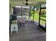 Cozy screened patio with ample seating, creating a relaxing outdoor space for leisure and gatherings at 482 Pendleton Pl, Venice, FL 34292