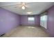 Bedroom featuring carpeted floors, standard lighting, and window at 527 Walnut Cir, Venice, FL 34285