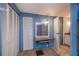 Bedroom showcasing ample closet space, a built in vanity and adjacent bathroom at 527 Walnut Cir, Venice, FL 34285