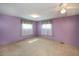 Bedroom featuring carpeted floors, standard lighting, and windows at 527 Walnut Cir, Venice, FL 34285