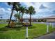 Community center featuring a well manicured lawn and lush landscaping at 527 Walnut Cir, Venice, FL 34285