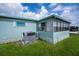 Angle shot of exterior featuring air conditioner and screened in porch at 527 Walnut Cir, Venice, FL 34285