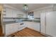 Functional kitchen featuring white appliances, plenty of cabinets, and a practical layout for cooking at 527 Walnut Cir, Venice, FL 34285