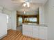 Open kitchen area with a view of the adjacent living space, with practical countertops and storage solutions at 527 Walnut Cir, Venice, FL 34285