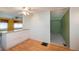 Functional kitchen area with pass through to the living room, laminate flooring, and a neutral color scheme at 527 Walnut Cir, Venice, FL 34285
