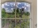 A stunning view of nature from the condo's private balcony with lush greenery at 5459 Bentgrass Dr # 2-304, Sarasota, FL 34235