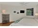 Cozy bedroom featuring a decorative headboard and stylish furniture at 5459 Bentgrass Dr # 2-304, Sarasota, FL 34235