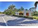 The Las Palmas luxury condominiums entrance featuring meticulously manicured landscaping at 5459 Bentgrass Dr # 2-304, Sarasota, FL 34235