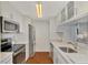 Modern kitchen featuring stainless steel appliances and bright lighting at 5459 Bentgrass Dr # 2-304, Sarasota, FL 34235