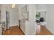 Well lit kitchen featuring stainless appliances, laminate floors and white cabinets at 5459 Bentgrass Dr # 2-304, Sarasota, FL 34235