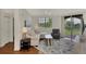 Bright living room with a comfortable couch, large window, and a view of the outdoors at 5459 Bentgrass Dr # 2-304, Sarasota, FL 34235