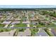 A well maintained residential neighborhood with lush green lawns, mature trees, and manicured landscaping at 5828 Lincoln Rd, Venice, FL 34293