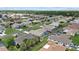 An aerial view of a well-maintained neighborhood with lush green lawns and mature landscaping at 5828 Lincoln Rd, Venice, FL 34293