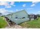 See the exterior of this home with landscaped yard, including a private backyard pool area at 5828 Lincoln Rd, Venice, FL 34293