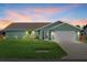 Charming single-story home with well-manicured lawn and attached two-car garage with driveway at 5828 Lincoln Rd, Venice, FL 34293