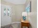 Inviting foyer with wood floors, and a stained glass entry door at 5828 Lincoln Rd, Venice, FL 34293