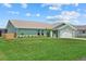 Lovely single-story home with a well-maintained lawn, fresh landscaping, and an attached garage at 5828 Lincoln Rd, Venice, FL 34293