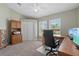 Bright office space with two windows, storage cabinets, and a desk area for productivity at 5828 Lincoln Rd, Venice, FL 34293