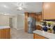 Modern kitchen featuring stainless steel fridge, and wooden cabinets at 5828 Lincoln Rd, Venice, FL 34293