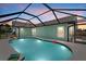 Outdoor pool provides relaxation and recreation, surrounded by lush landscaping for privacy at 5828 Lincoln Rd, Venice, FL 34293