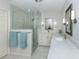 Modern bathroom featuring double sinks, quartz countertops and glass shower at 609 Madrid Ave, Venice, FL 34285