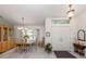 Elegant dining room with tile flooring, a traditional china cabinet, and direct access to the entryway at 609 Madrid Ave, Venice, FL 34285