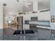 Bright kitchen features stainless steel appliances, granite countertops, and white cabinetry at 609 Madrid Ave, Venice, FL 34285