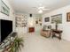 Spacious living room with built-in bookshelves, plush seating, and lots of natural light at 609 Madrid Ave, Venice, FL 34285