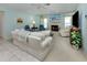 Bright living room with a fireplace, comfortable seating, and a view of the backyard at 609 Madrid Ave, Venice, FL 34285