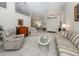 Open-concept living room featuring tile floors, high ceilings, and an elegant doorway leading to the dining room at 609 Madrid Ave, Venice, FL 34285