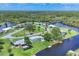 Aerial view of a waterfront community with canals and mature trees at 6821 Marius Rd, North Port, FL 34287