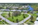 An elevated community shot with waterfront homes along canals, beautiful landscaping, and neighborhood amenities at 6821 Marius Rd, North Port, FL 34287