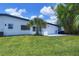 This home boasts a well-maintained backyard, a cozy patio, and lush landscaping at 6821 Marius Rd, North Port, FL 34287