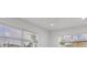Bright bedroom with large windows offering natural light and views of the outdoors at 6821 Marius Rd, North Port, FL 34287