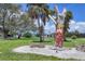 The community features a unique carved tree sculpture at 6821 Marius Rd, North Port, FL 34287