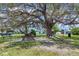 This community boasts a large tree with benches and picnic tables at 6821 Marius Rd, North Port, FL 34287