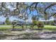 The community space is enhanced by picnic tables under a tree, creating a welcoming outdoor gathering spot at 6821 Marius Rd, North Port, FL 34287