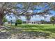 The community has green spaces with large trees at 6821 Marius Rd, North Port, FL 34287