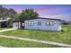 Well-maintained home with manicured lawn, modern design, and enhanced curb appeal on a gorgeous clear day at 6821 Marius Rd, North Port, FL 34287