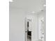 Bright hallway leading to bedrooms and bathroom at 6821 Marius Rd, North Port, FL 34287