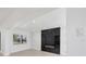Bright living room boasts a sleek black marble fireplace and recessed lighting at 6821 Marius Rd, North Port, FL 34287