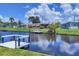 This home has waterfront views and a private dock at 6821 Marius Rd, North Port, FL 34287