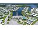 This is an aerial view of a marina, canal, pool, clubhouse and shuffleboard courts in a waterfront community at 738 Riverview Cir, North Port, FL 34287