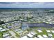 Extensive aerial view of a community featuring a community center, pool, marina, and the intercoastal waterway at 738 Riverview Cir, North Port, FL 34287