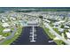 Expansive aerial view of a waterfront community featuring a community center, pool, marina, and well-maintained homes at 738 Riverview Cir, North Port, FL 34287