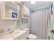 Bright bathroom featuring a shower, vanity, and plenty of storage space at 738 Riverview Cir, North Port, FL 34287